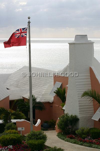 IMG_JE.R07.JPG - Roofline and flag at the Reefs, South Shore, Bermuda