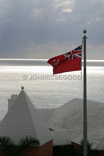 IMG_JE.R10.JPG - Roofline and flag at the Reefs, South Shore, Bermuda