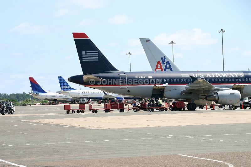 IMG_JE.AI01.JPG - Plane tails with logos, Bermuda International Airport